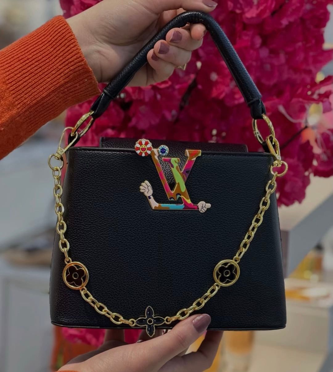 Opulent Black Leather Handbag with Colorful LV Emblem